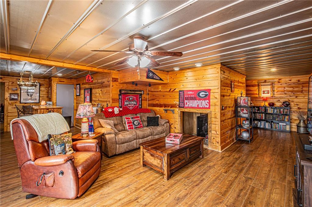 3718 Pebble Creek Point Gainesville, GA 30506 - Photo 89 of 144 a outdoor space with lots of furniture and a flat screen tv