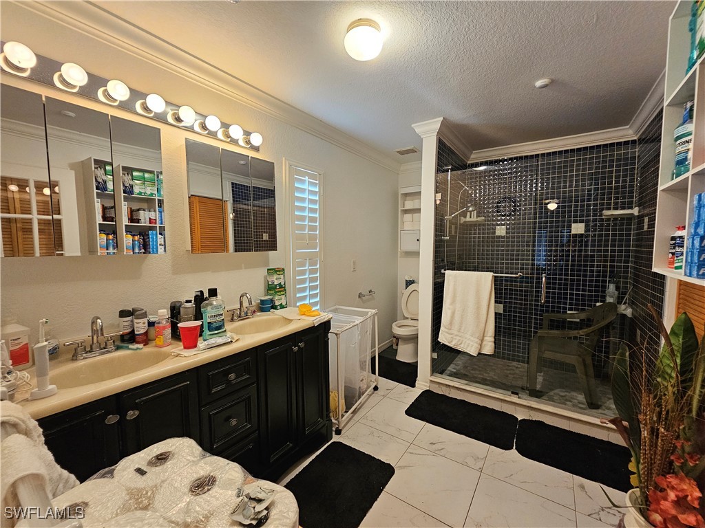 3903 1st Street Southwest Lehigh Acres, FL 33976 - Photo 16 of 25 a bathroom with a sink mirror and shower
