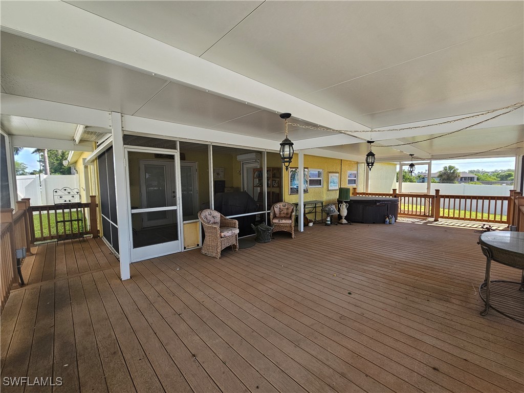 3903 1st Street Southwest Lehigh Acres, FL 33976 - Photo 20 of 25 a view of a livingroom with furniture and floor to ceiling window