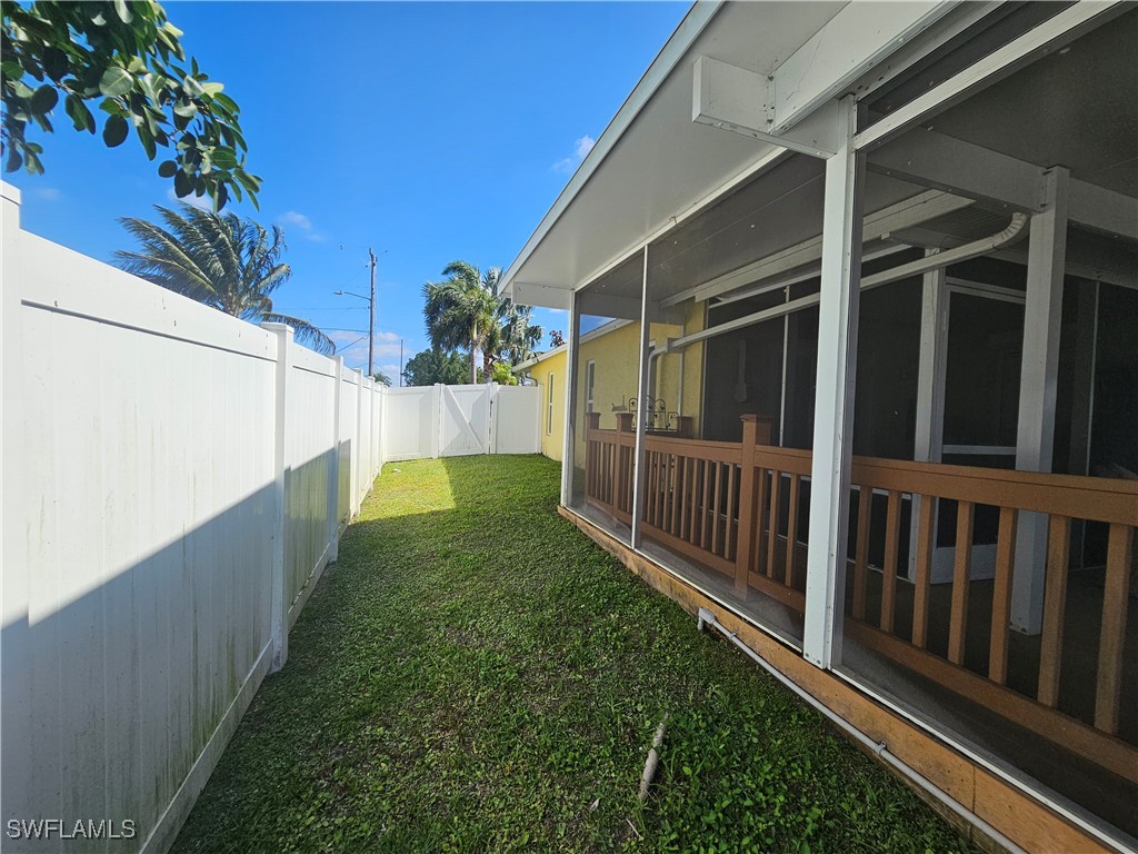3903 1st Street Southwest Lehigh Acres, FL 33976 - Photo 25 of 25 a view of a wooden fence