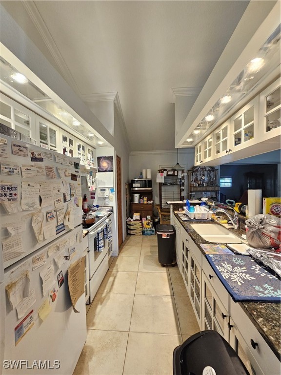 3903 1st Street Southwest Lehigh Acres, FL 33976 - Photo 7 of 25 a kitchen with stainless steel appliances granite countertop a stove and a sink