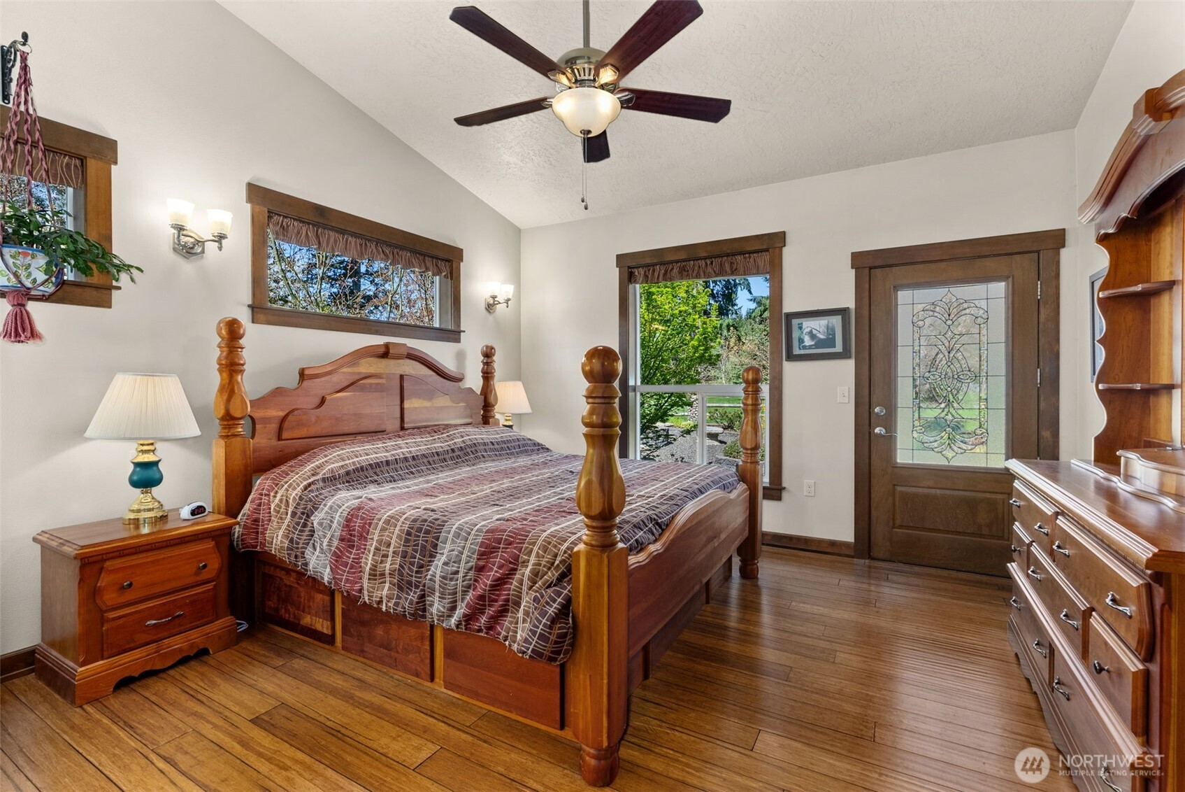 139 Ramsey Road Chehalis, WA 98532 - Photo 16 of 40 a bedroom with a bed and a chandelier