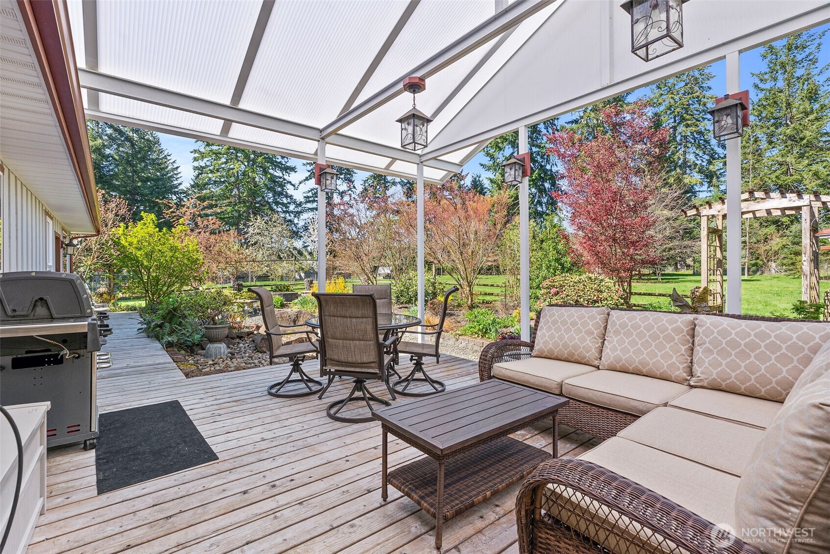 139 Ramsey Road Chehalis, WA 98532 - Photo 28 of 40 a living room with patio furniture and a floor to ceiling window