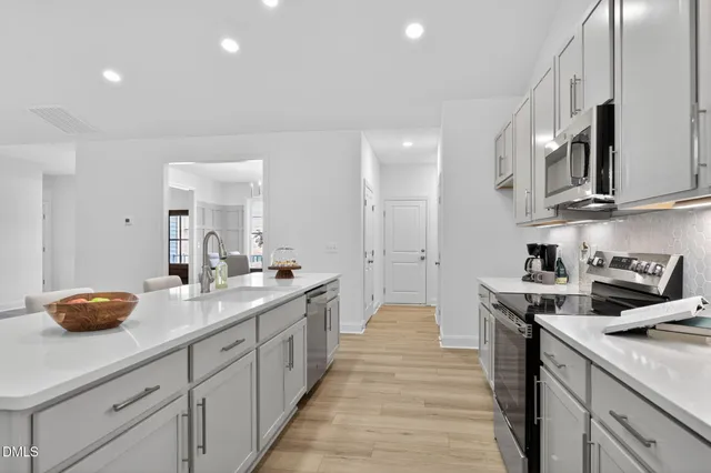 a bathroom with a double vanity sink and a mirror