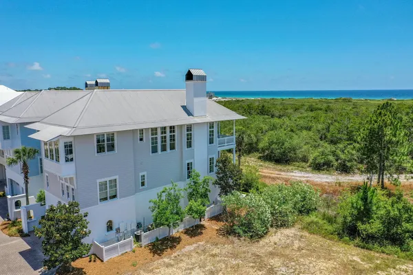 a aerial view of a house with a yard