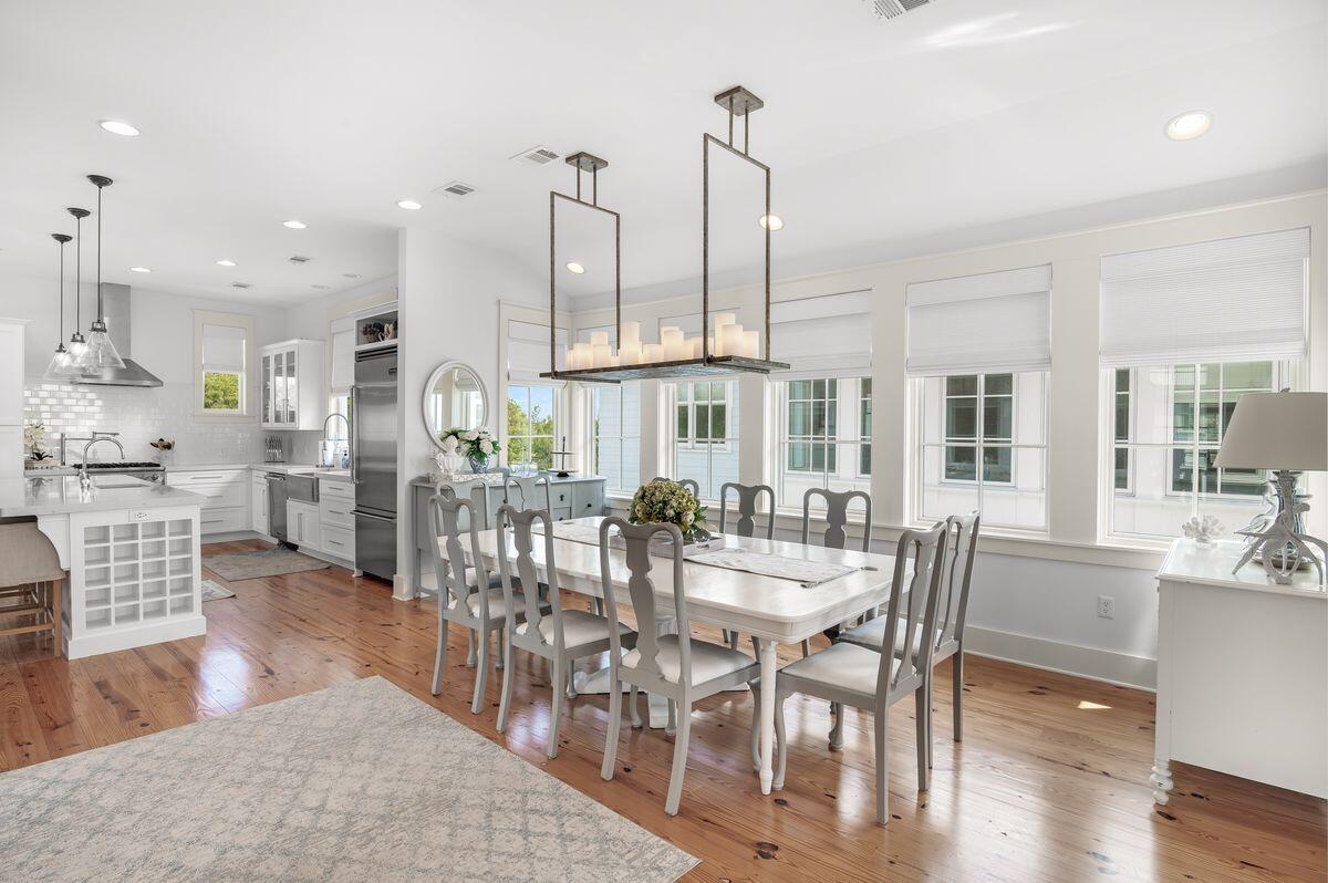 187 Cypress Drive Santa Rosa Beach, FL 32459 - Photo 16 of 58 a view of a dining room and livingroom with furniture wooden floor kitchen view