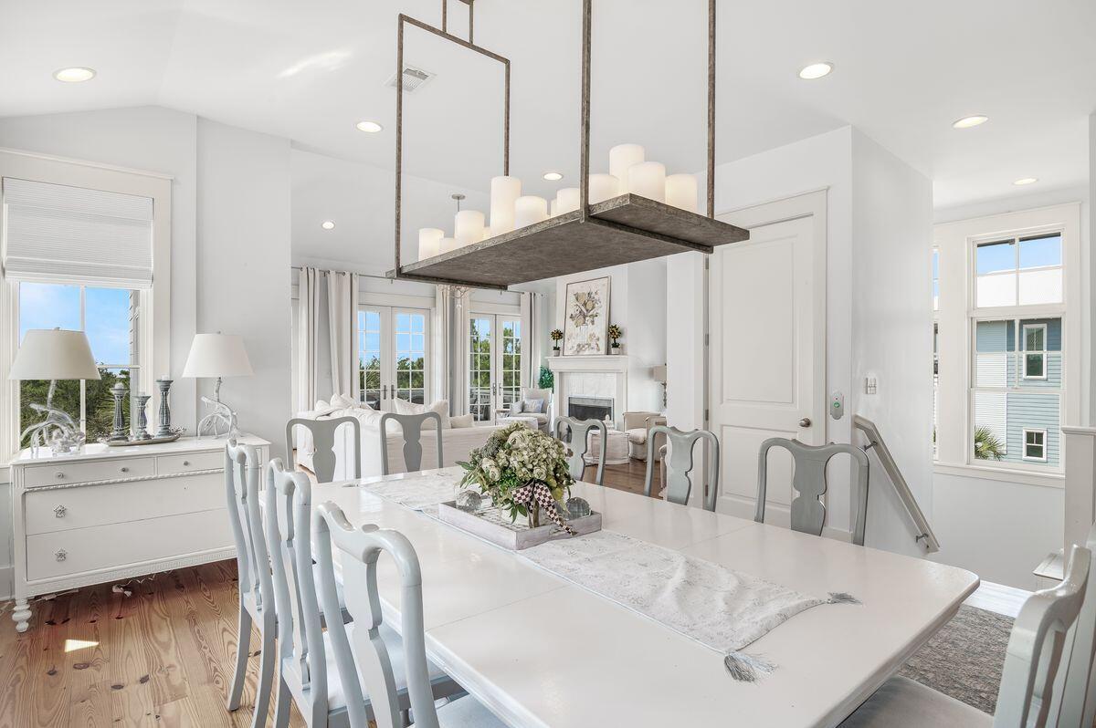 187 Cypress Drive Santa Rosa Beach, FL 32459 - Photo 18 of 58 a view of a dining room with furniture window and wooden floor