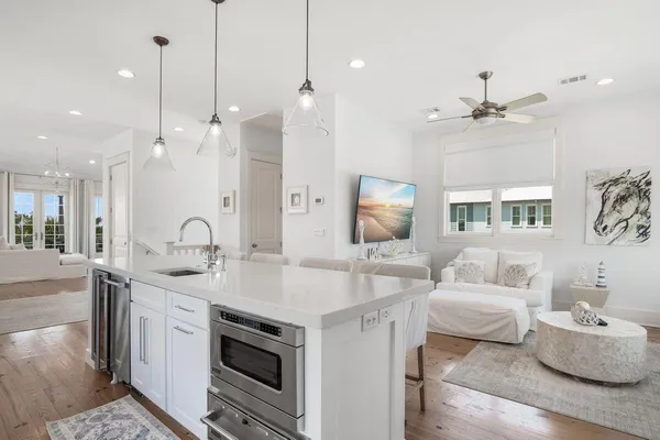 a bathroom with a granite countertop toilet sink and mirror