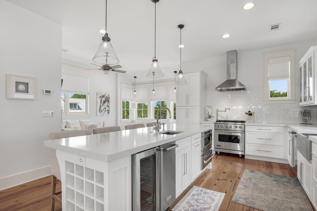 187 Cypress Drive Santa Rosa Beach, FL 32459 - Photo 23 of 58 a kitchen with stainless steel appliances granite countertop a sink a stove and a refrigerator