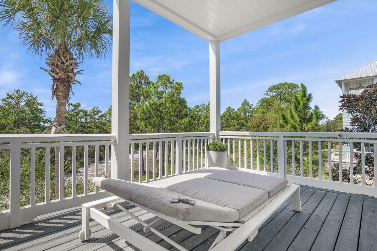 187 Cypress Drive Santa Rosa Beach, FL 32459 - Photo 27 of 58 a view of balcony with wooden floor and outdoor seating