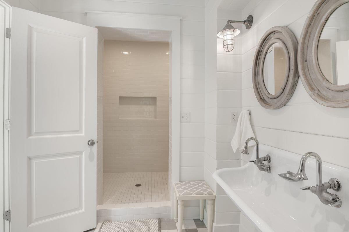 187 Cypress Drive Santa Rosa Beach, FL 32459 - Photo 38 of 58 a bathroom with a sink and a mirror