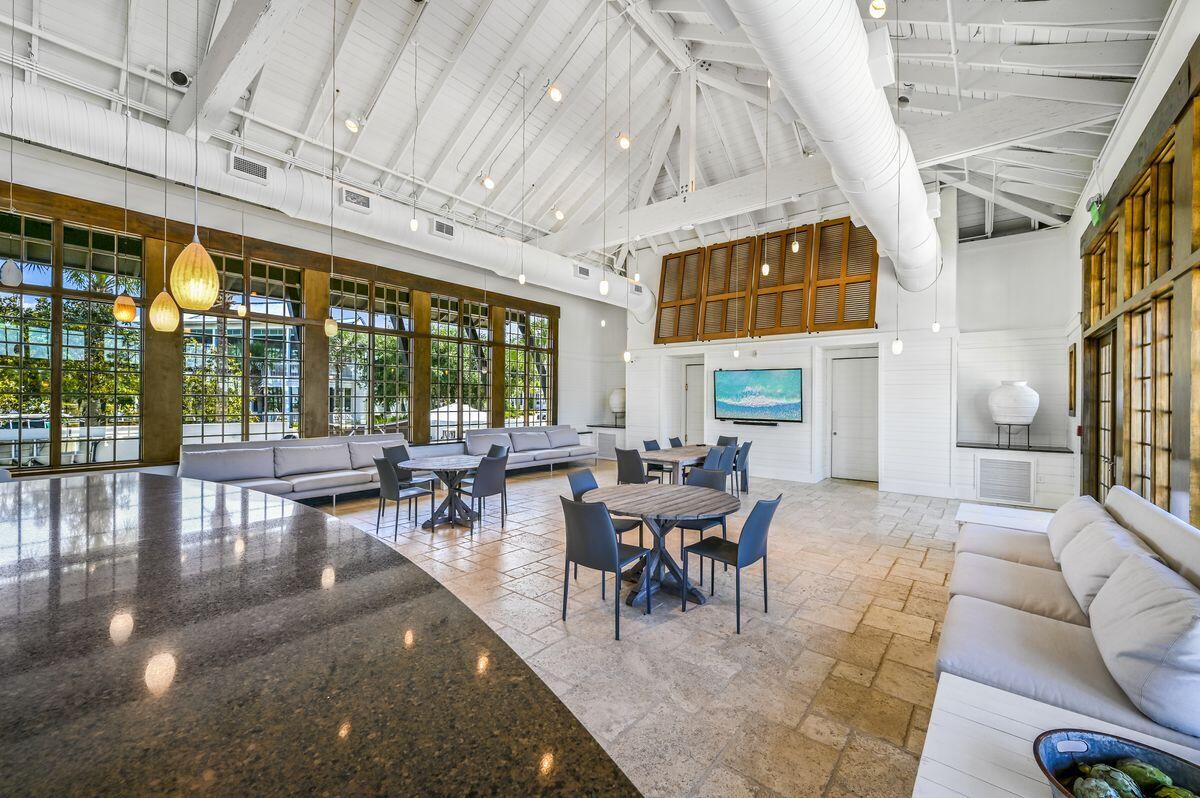 187 Cypress Drive Santa Rosa Beach, FL 32459 - Photo 50 of 58 a living room with furniture a fireplace and large windows