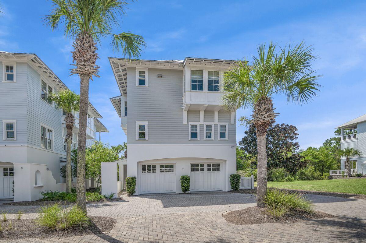 187 Cypress Drive Santa Rosa Beach, FL 32459 - Photo 5 of 58 a front view of a house with a yard and garage