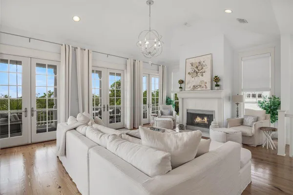 a view of a balcony with couches and wooden floor