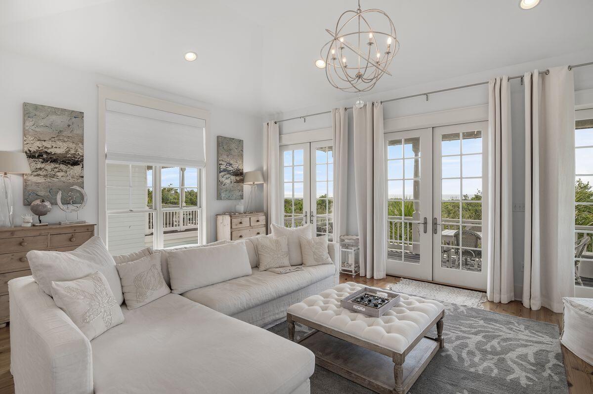 187 Cypress Drive Santa Rosa Beach, FL 32459 - Photo 10 of 58 a living room with furniture and a dining table