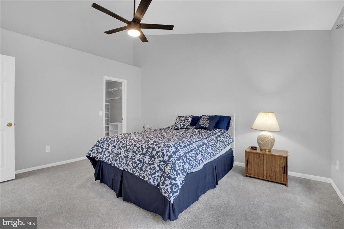 7523 Westmore Drive Springfield, VA 22150 - Photo 17 of 37 a bedroom with a bed and a lamp