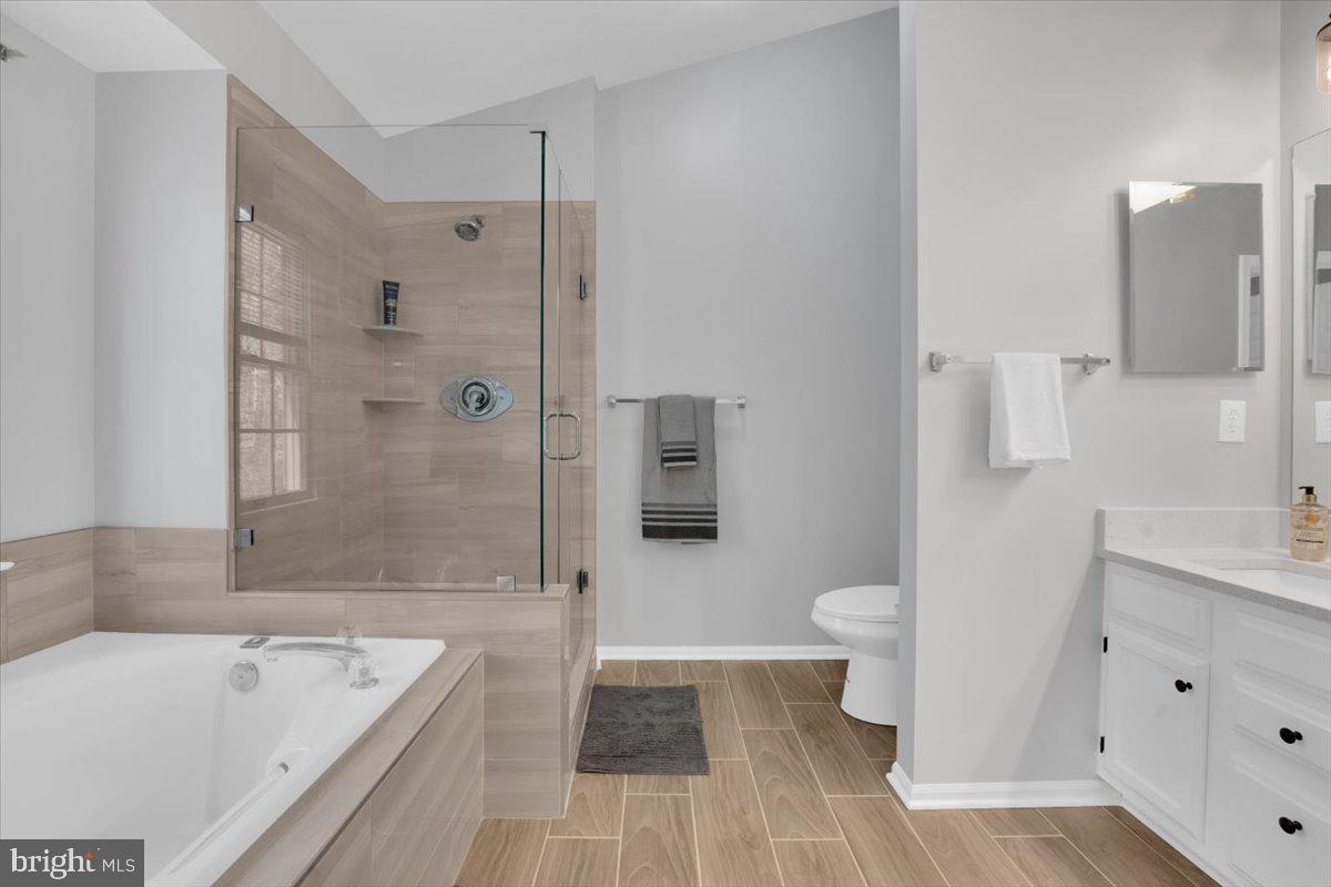 7523 Westmore Drive Springfield, VA 22150 - Photo 19 of 37 a bathroom with a tub sink toilet and shower