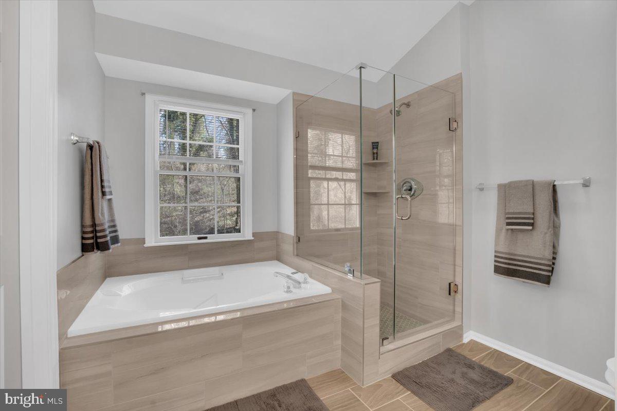 7523 Westmore Drive Springfield, VA 22150 - Photo 20 of 37 a spacious bathroom with a bathtub and a shower
