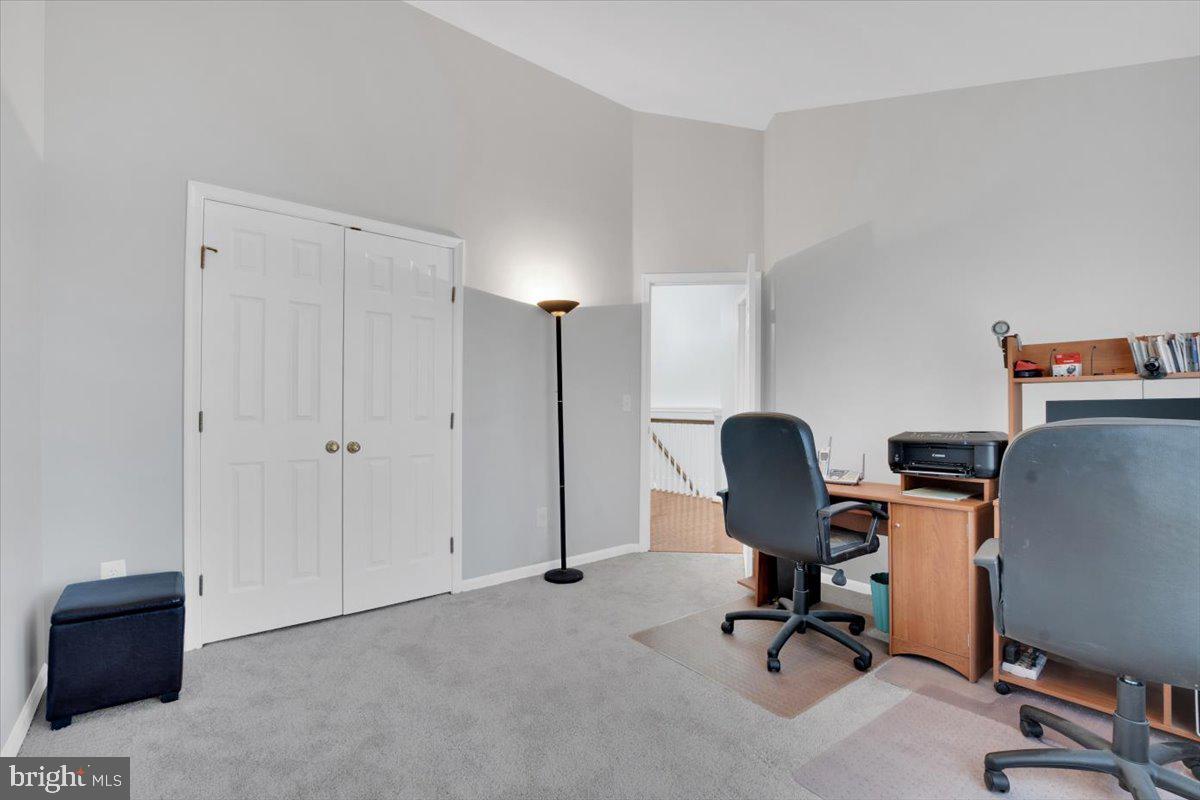 7523 Westmore Drive Springfield, VA 22150 - Photo 24 of 37 a view of a workspace with furniture and a window
