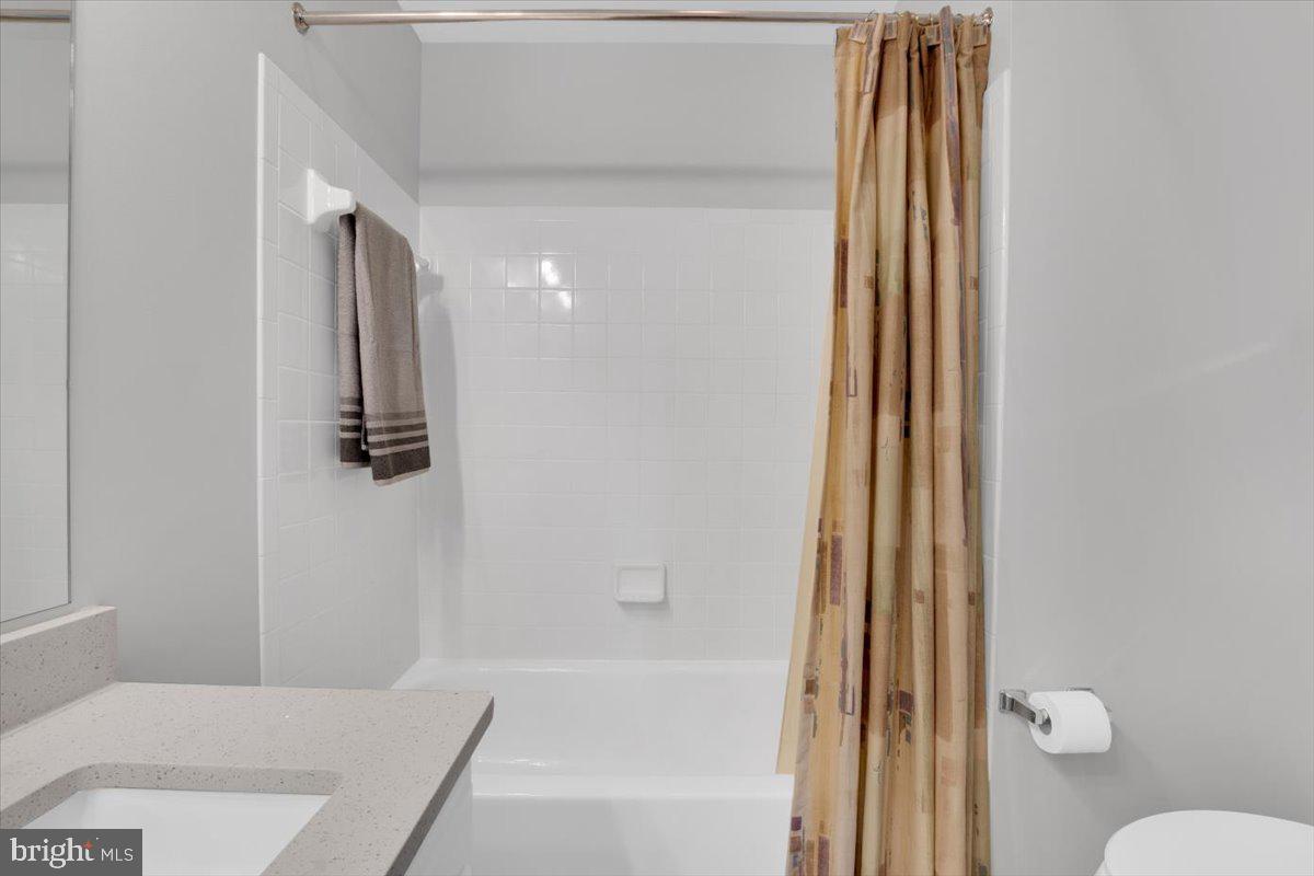 7523 Westmore Drive Springfield, VA 22150 - Photo 26 of 37 a bathroom with a bathtub and shower