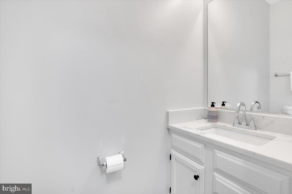 7523 Westmore Drive Springfield, VA 22150 - Photo 27 of 37 a bathroom with a sink vanity and a mirror