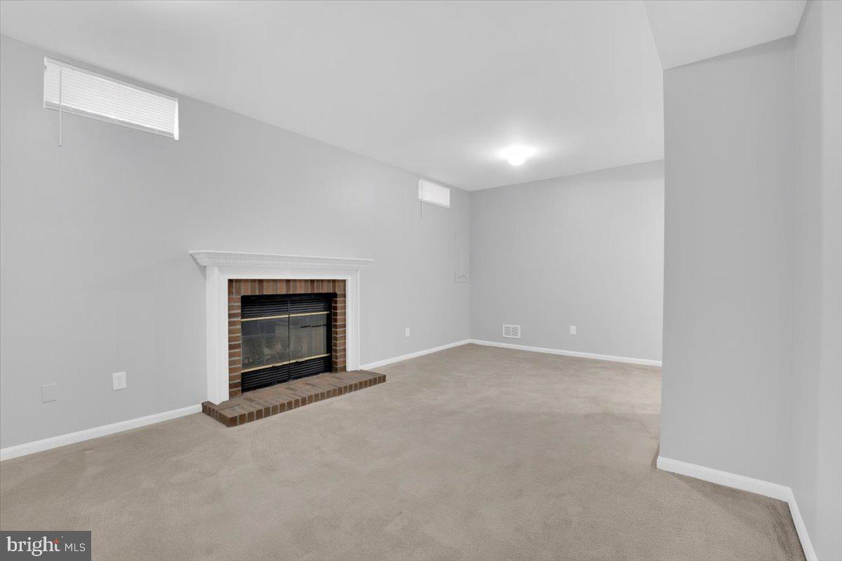 7523 Westmore Drive Springfield, VA 22150 - Photo 29 of 37 a view of empty room with a fireplace