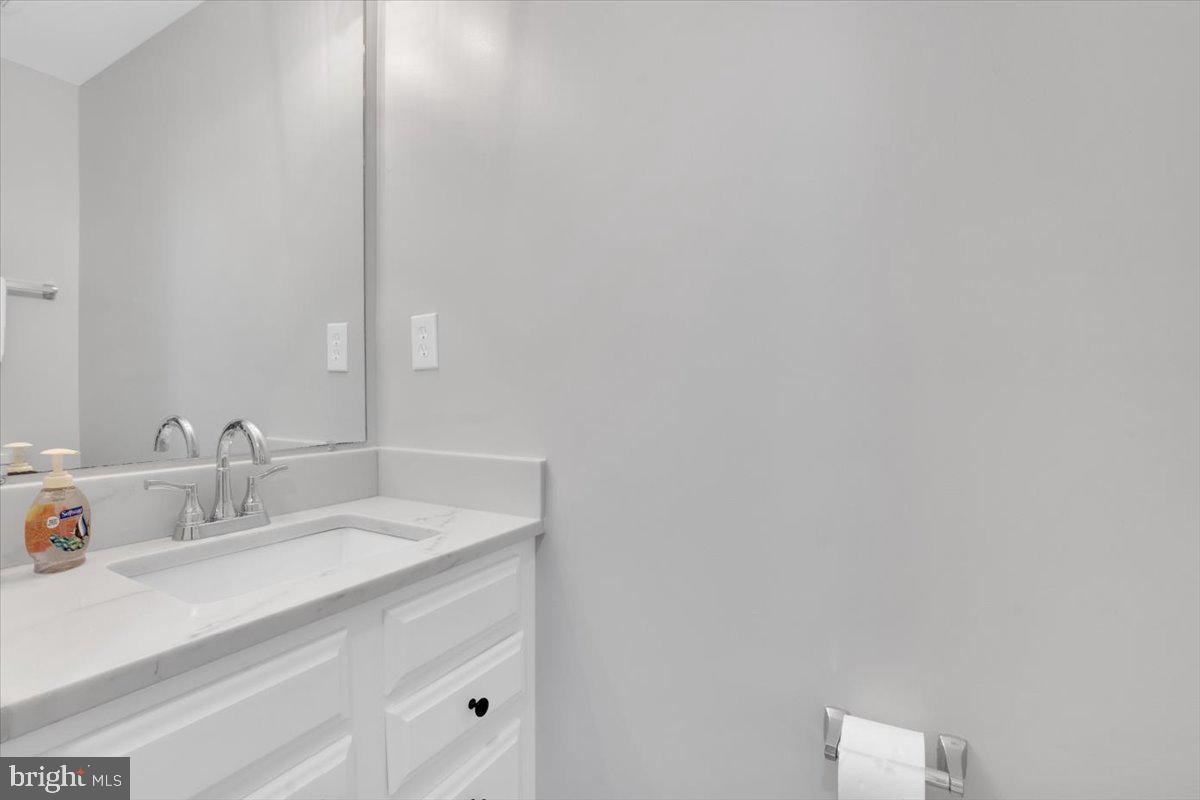 7523 Westmore Drive Springfield, VA 22150 - Photo 30 of 37 a bathroom with a sink and a mirror