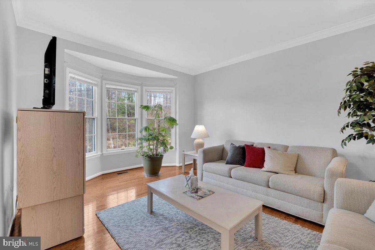 7523 Westmore Drive Springfield, VA 22150 - Photo 3 of 37 a living room with furniture and wooden floor