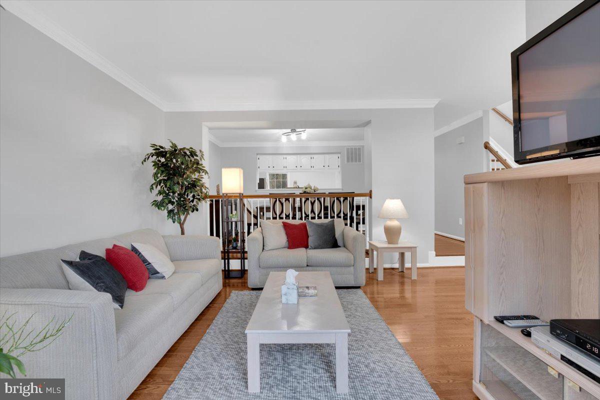 7523 Westmore Drive Springfield, VA 22150 - Photo 5 of 37 a living room with furniture and a flat screen tv