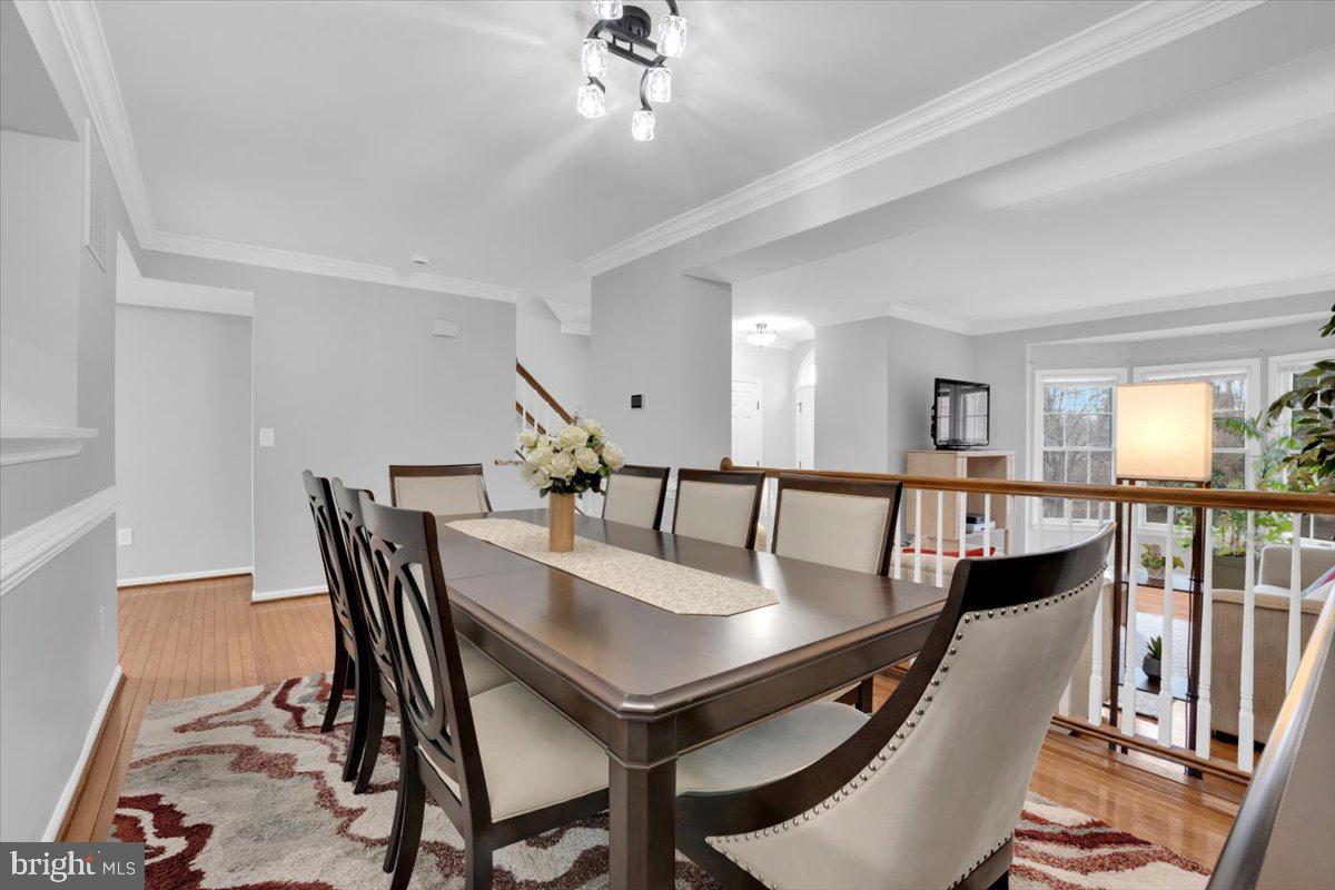 7523 Westmore Drive Springfield, VA 22150 - Photo 6 of 37 a view of a dining room with furniture and a chandelier
