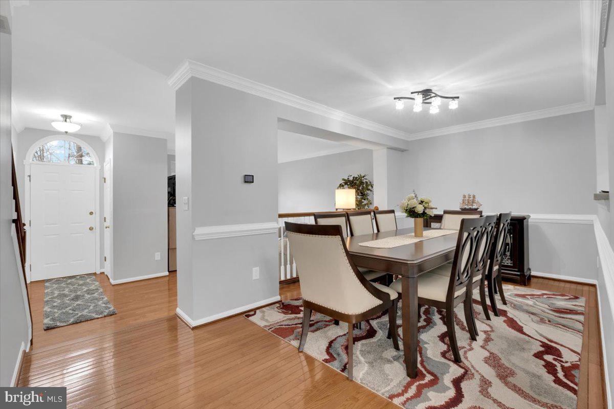 7523 Westmore Drive Springfield, VA 22150 - Photo 7 of 37 a view of a dining room with furniture and wooden floor