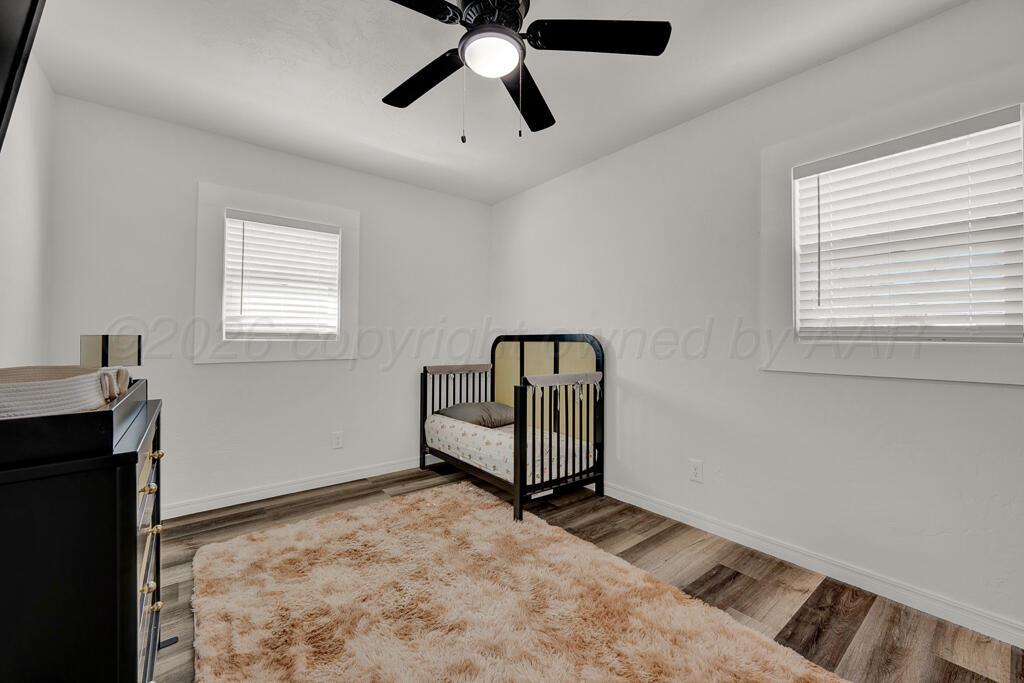 1926 South Highland Street Amarillo, TX 79103 - Photo 12 of 16 a view of a room with window and ceiling fan