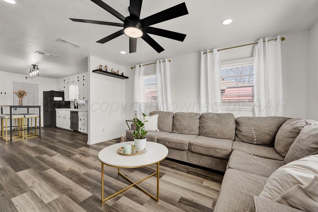 1926 South Highland Street Amarillo, TX 79103 - Photo 2 of 16 a living room with furniture and kitchen view