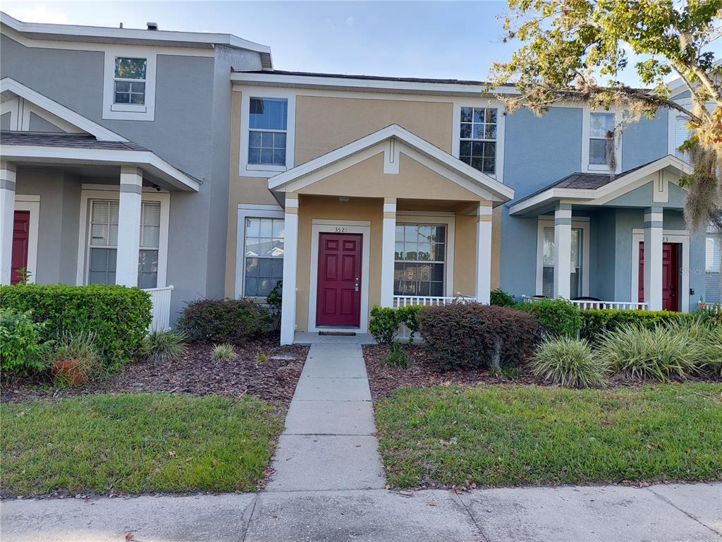 3521 Red Rock Drive Land O Lakes, FL 34639 - Photo 1 of 13 a front view of a house with garden