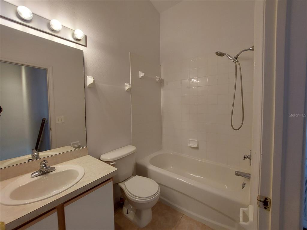3521 Red Rock Drive Land O Lakes, FL 34639 - Photo 12 of 13 a bathroom with a sink a toilet and shower