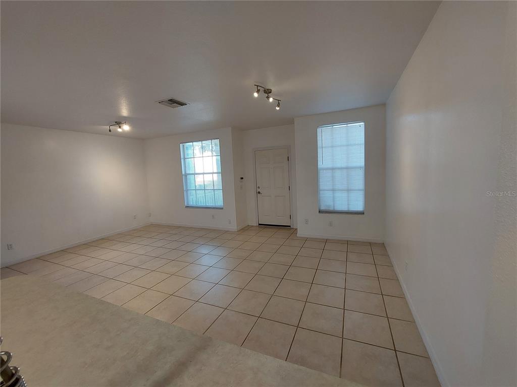 3521 Red Rock Drive Land O Lakes, FL 34639 - Photo 4 of 13 an empty room with windows