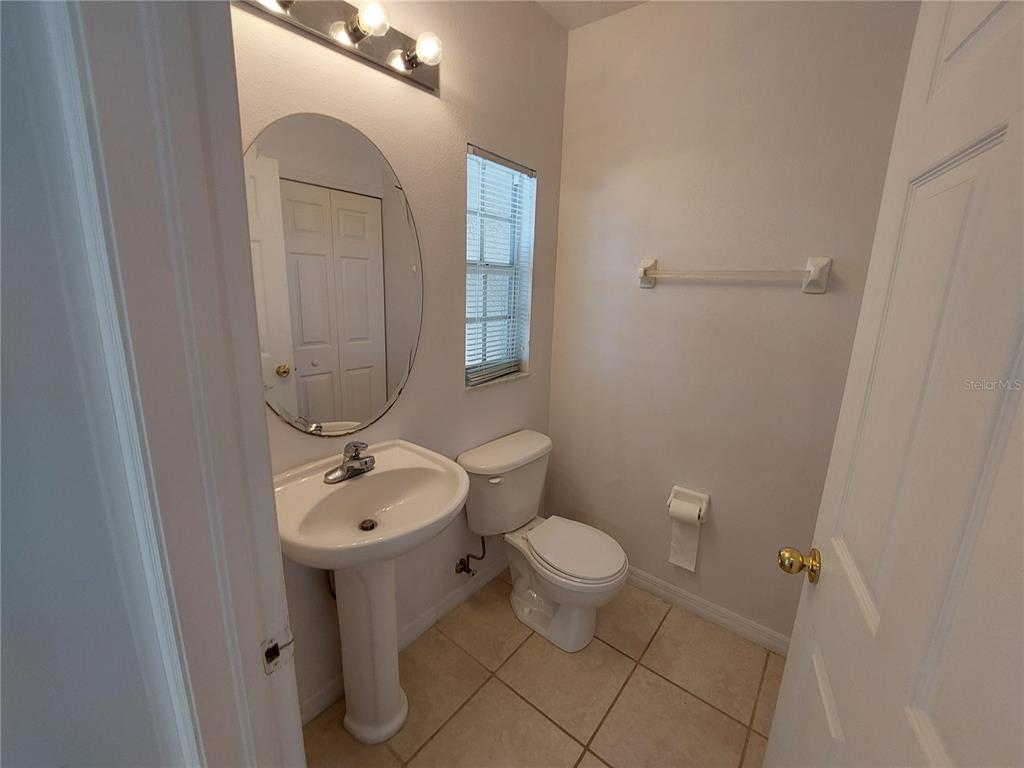 3521 Red Rock Drive Land O Lakes, FL 34639 - Photo 6 of 13 a bathroom with a toilet sink and mirror