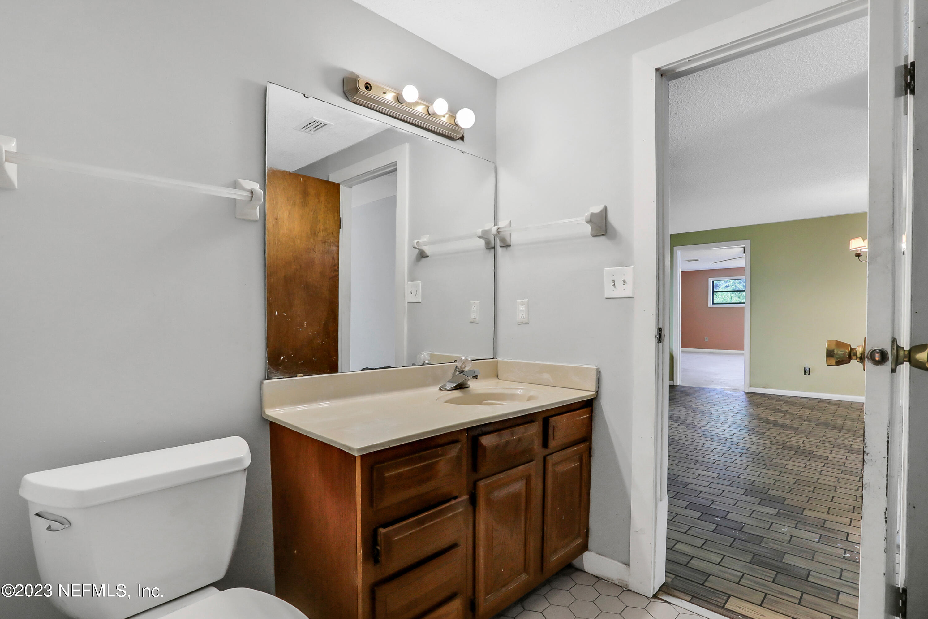 4053 Appaloosa Road Middleburg, FL 32068 - Photo 34 of 36 a bathroom with a sink toilet and shower