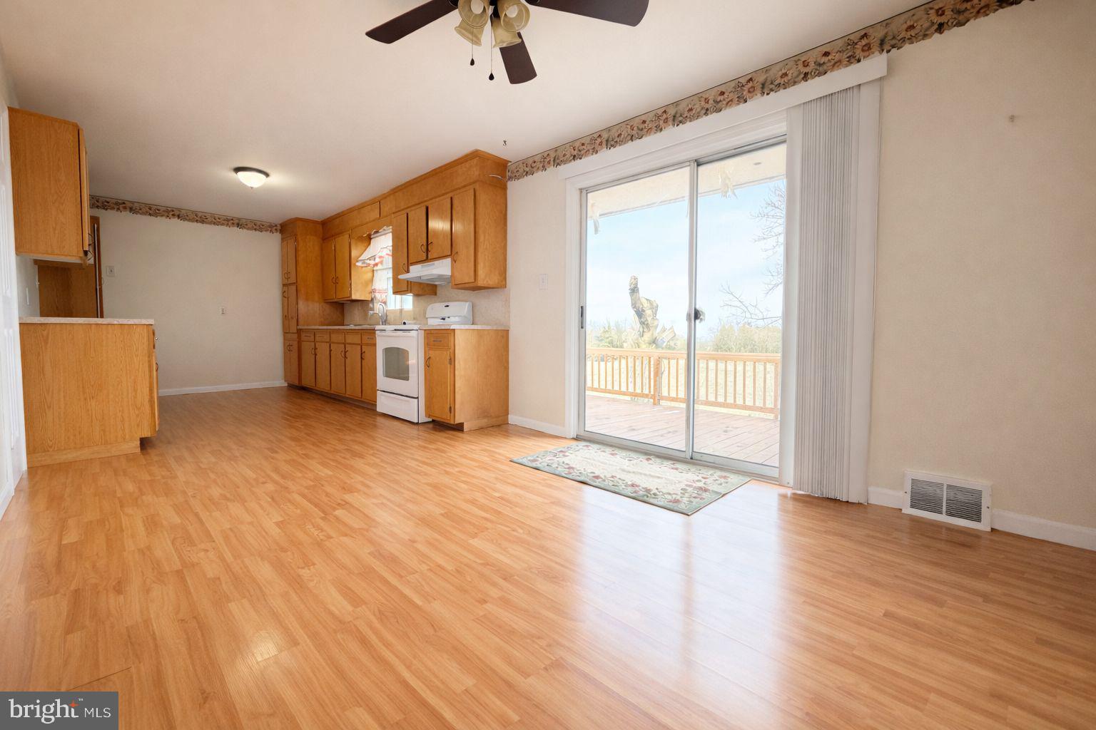 3891 Coseytown Road Greencastle, PA 17225 - Photo 11 of 50 a view of a kitchen with a sink and dishwasher a refrigerator with wooden floor