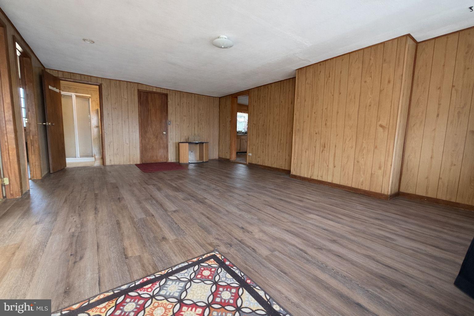 3891 Coseytown Road Greencastle, PA 17225 - Photo 20 of 50 an empty room with wooden floor and a window