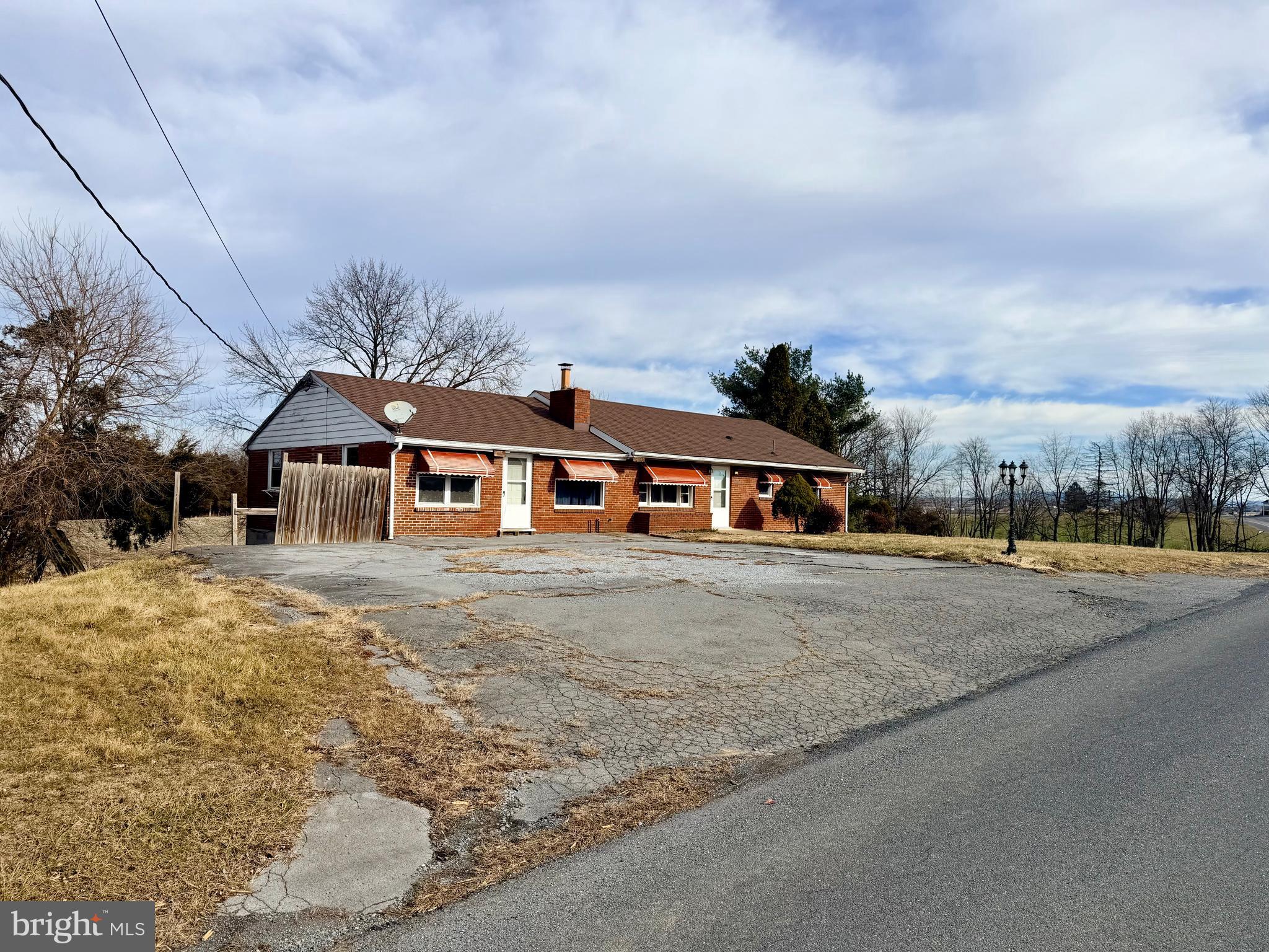 3891 Coseytown Road Greencastle, PA 17225 - Photo 4 of 50 a front view of a house with a yard and garage