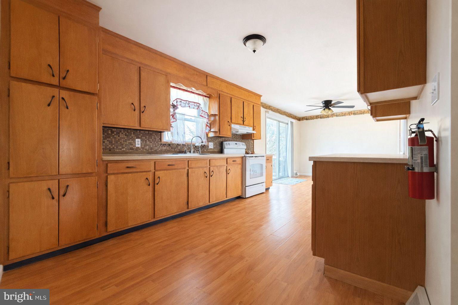 3891 Coseytown Road Greencastle, PA 17225 - Photo 10 of 50 a kitchen with stainless steel appliances a refrigerator sink and cabinets