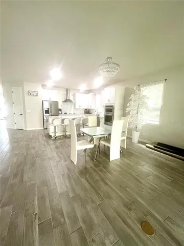 a spacious bedroom with a bed and a window