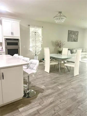 a living room with furniture and flowers