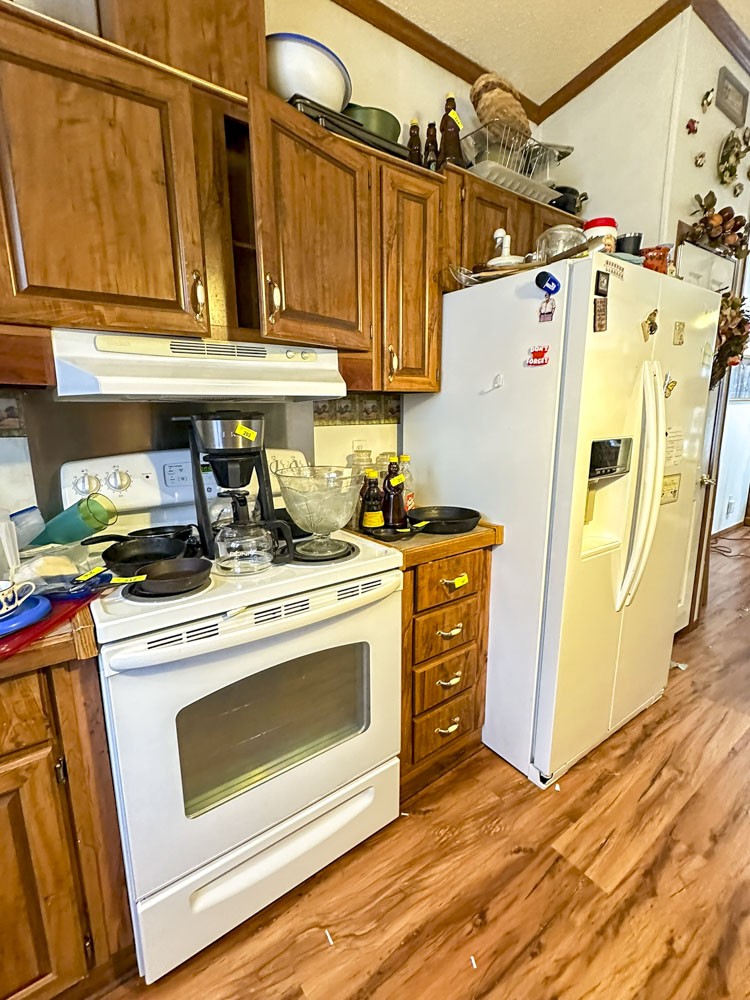 2641 Stanley Valley Road Surgoinsville, TN 37873 - Photo 14 of 26 a kitchen with a stove top oven and cabinets