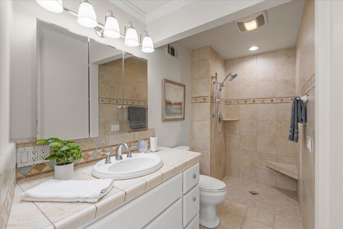 6535 Kings Place Gilroy, CA 95020 - Photo 17 of 25 a bathroom with a sink toilet and shower