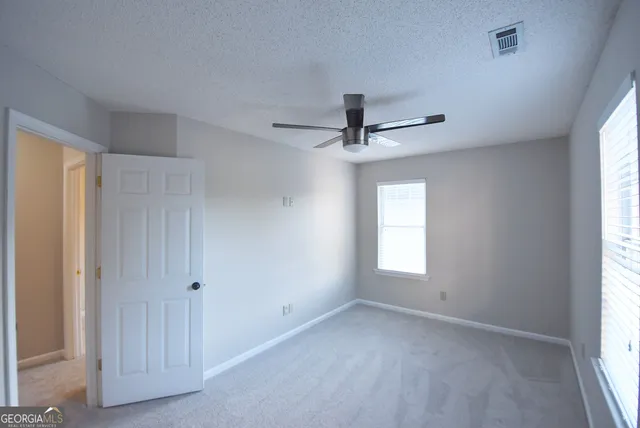 a view of empty room with windows