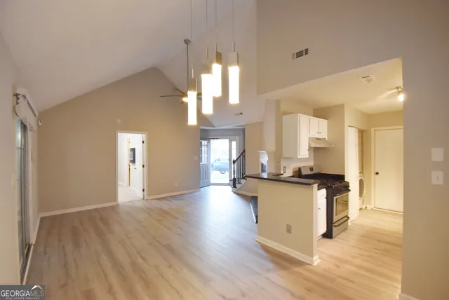 a kitchen with sink and cabinets