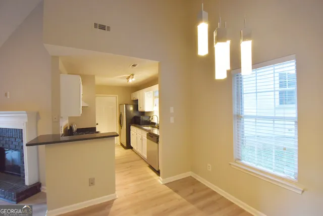 a view of a kitchen with a window