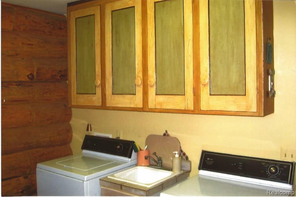 4499 Brown Road Metamora, MI 48455 - Photo 22 of 36 Laundry rm cupboards.jpg